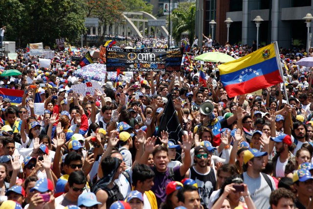 Anti-government protesters march during a demonstration in Caracas