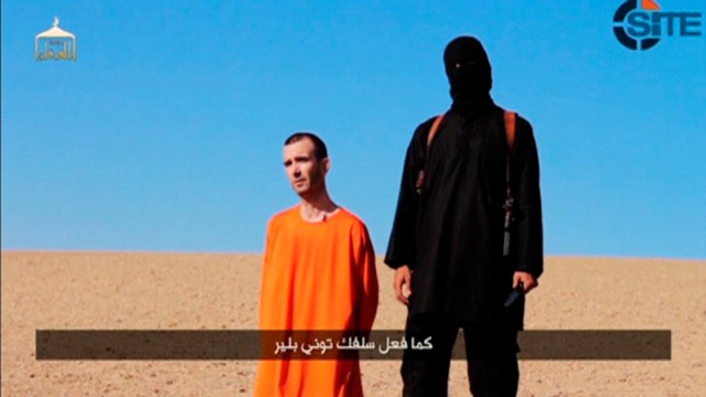 A still image taken from a purported Islamic State video of British captive David Haines before he is beheaded