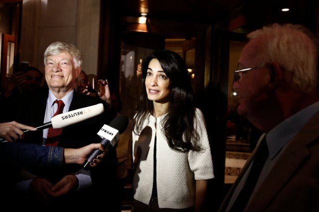 Human rights lawyer Amal Alamuddin Clooney makes statements after her arrival at a hotel in Athens