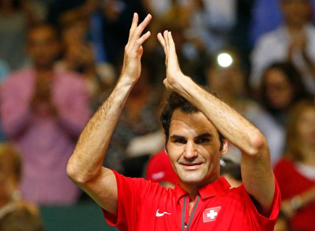 Federer reacts after winning his Davis Cup semi-final tennis match against Fognini at the Palexpo in Geneva