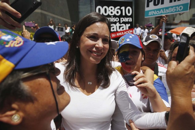 Venezuela's opposition leader Machado greets supporters during a rally to commemorate International Women's Day and in support of jailed opposition leaders, Lopez and Ledezma, in Caracas