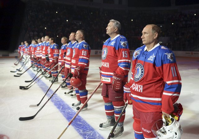 Putin takes part in a ceremony before a gala game opening a new season of the Night Ice Hockey League in Sochi