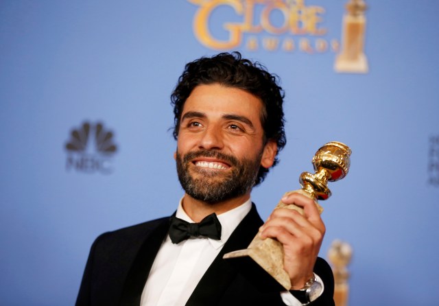 Oscar Issac poses backstage with the award for Best Performance by an Actor in a Limited Series or a Motion Picture Made for Television for his role in "Show Me a Hero" during the 73rd Golden Globe Awards in Beverly Hills, California January 10, 2016.  REUTERS/Lucy Nicholson