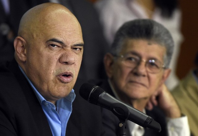 The secretary general of the Democratic Unity Roundtable (MUD), Jesus "Chuo" Torrealba (L), and the president of the Venezuelan National Assembly, Henry Ramos Allup , offer a press conference in Caracas on March 8, 2016. Venezuela's opposition called for the "largest movement that has ever existed" to oust President Nicolas Maduro, vowing to pursue all means to force him from power. The opposition, which has been on a collision course with Maduro since winning control of the legislature in December, spent weeks deciding on its strategy to remove the deeply unpopular socialist president -- whether through a referendum, a constitutional amendment or the drafting of a new constitution.  AFP PHOTO / JUAN BARRETO / AFP / JUAN BARRETO