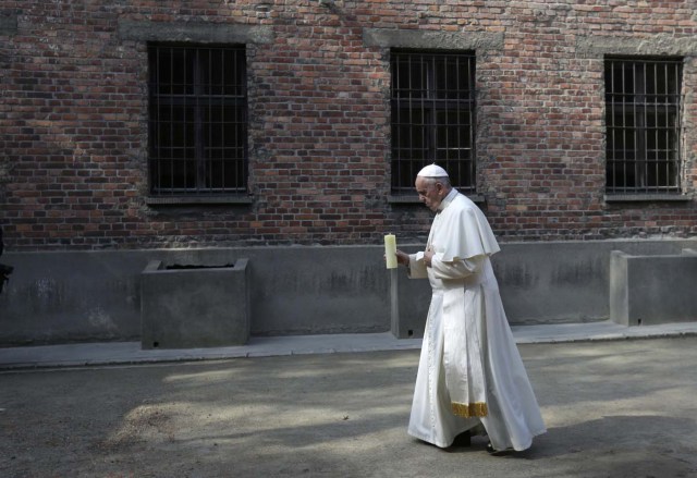 Pope Francis walks to the death wall in the former Nazi German concentration and extermination camp Auschwitz-Birkenau in Oswiecim, Poland, July 29, 2016. REUTERS/David W Cerny