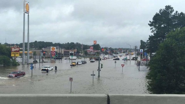 Floodwaters are seen on Range Road and I-12 in Denham Springs, Livingston Parish, Louisiana, U.S., August 13, 2016. Louisiana Department of Transportation and Development/Handout via REUTERS ATTENTION EDITORS - THIS IMAGE WAS PROVIDED BY A THIRD PARTY. EDITORIAL USE ONLY