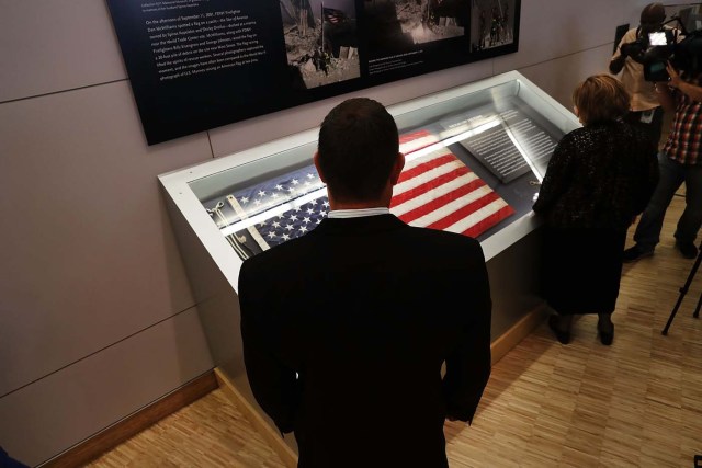 NEW YORK, NY - SEPTEMBER 08: The American flag that was raised by firefighters above the site of the 9/11 attacks on the World Trade Center in New York on 2001 is displayed for the first time at the National September 11 Memorial & Museum after turning up in Washington state two years ago on September 8, 2016 in New York City. The flag was made iconic in a photo of firefighters raising it on the day of the attacks. The flag disappeared from Ground Zero during the site cleanup and was mysteriously turned into a police department by a man who gave his name only as "Brian". Sunday is the 15th anniversary of the terror attacks. Spencer Platt/Getty Images/AFP