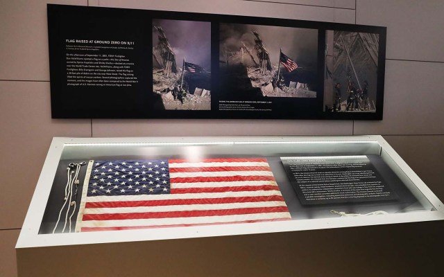 NEW YORK, NY - SEPTEMBER 08: The American flag that was raised by firefighters above the site of the 9/11 attacks on the World Trade Center in New York on 2001 is displayed for the first time at the National September 11 Memorial & Museum after turning up in Washington state two years ago on September 8, 2016 in New York City. The flag was made iconic in a photo of firefighters raising it on the day of the attacks. The flag disappeared from Ground Zero during the site cleanup and was mysteriously turned into a police department by a man who gave his name only as "Brian". Sunday is the 15th anniversary of the terror attacks. Spencer Platt/Getty Images/AFP