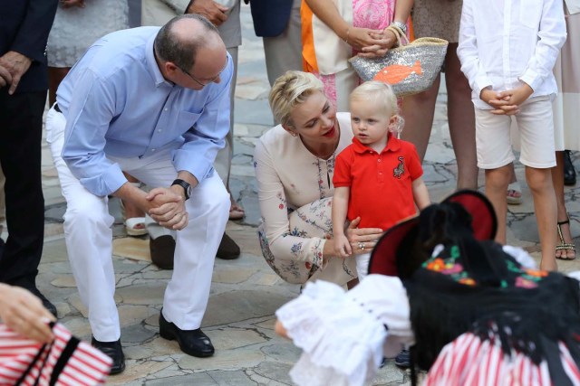 Prince Albert II of Monaco and his wife Charlene of Monaco attend a dance show with Prince Jacques, the heir apparent to the Monegasque throne during the traditional Monaco's picnic in Monaco, September 10, 2016. REUTERS/Valery Hache/Pool