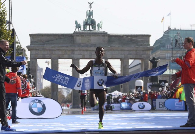 Kenenisa Bekele of Ethiopia crosses the finish line to win the men's competition at the Berlin marathon in Berlin, Germany, September 25, 2016. REUTERS/Fabrizio Bensch