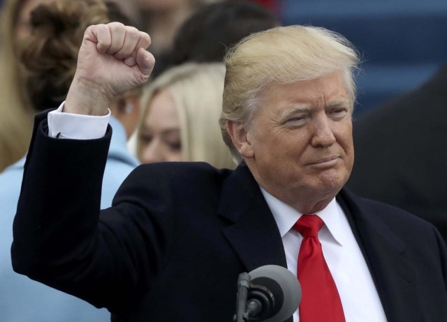 REFILE - ADDING MISSING WORD TO CAPTION - U.S. President Donald Trump raises his fist after being sworn in as the 45th president of the United States on the West front of the U.S. Capitol in Washington, U.S., January 20, 2017. REUTERS/Carlos Barria