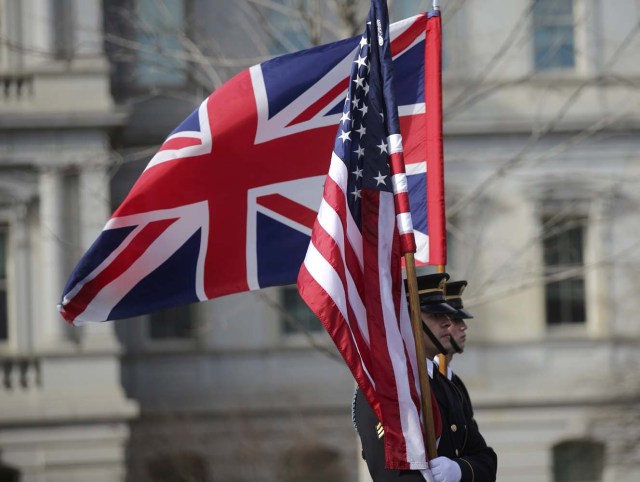 Members of a ceremonial guard carry flags prior to the arrival of British Prime Theresa May at the White House in Washington, U.S., January 27, 2017. REUTERS/Carlos Barria