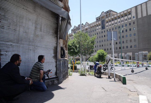 Members of Iranian forces take position during an attack on the Iranian parliament in central Tehran, Iran, June 7, 2017. Omid Vahabzadeh/TIMA via REUTERS ATTENTION EDITORS - THIS IMAGE WAS PROVIDED BY A THIRD PARTY. FOR EDITORIAL USE ONLY.