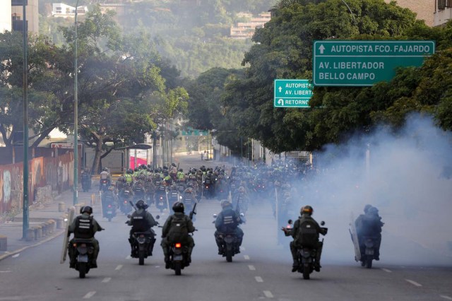 Security forces ride on motorcycles during a rally against Venezuela's President Nicolas Maduro's government in Caracas, Venezuela, June 26, 2017. REUTERS/Ivan Alvarado