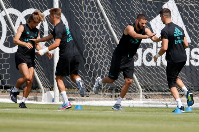 Football Soccer - Real Madrid training - University of California, Los Angeles, United States - July 13, 2017 Real Madrid's Karim Benzema (2nd R) and Luka Modric (L) train REUTERS/Lucy Nicholson