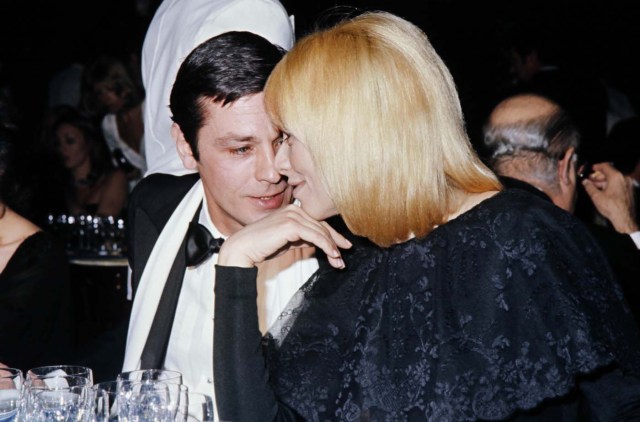 (FILES) This file photo taken on January 01, 1976 shows French actor Alain Delon and his companion, actress Mireille darc, during a gala event at the Casino Ruhl in Nice, southern France. Mireille Darc died at age 79 on August 28, 2017, according to her family. / AFP PHOTO / -