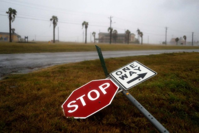 Street signs lie on the ground after winds from Hurricane Harvey escalated in Corpus Christi, Texas, U.S. August 25, 2017. REUTERS/Adrees Latif