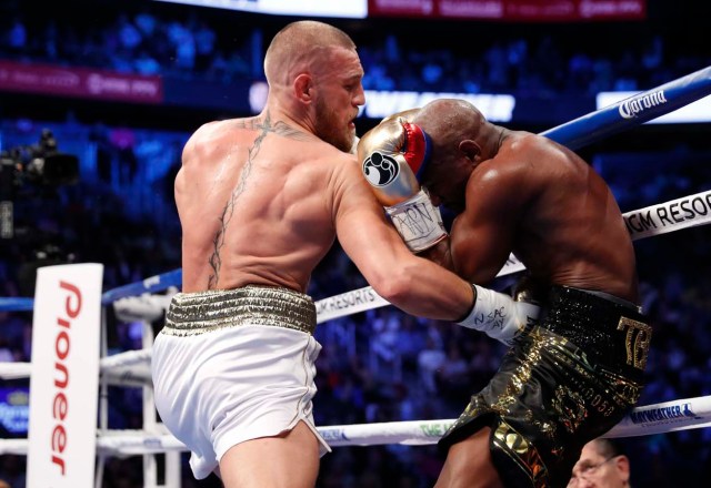 Boxing - Floyd Mayweather Jr. vs Conor McGregor - Las Vegas, USA - August 26, 2017 Conor McGregor in action with Floyd Mayweather Jr. REUTERS/Steve Marcus