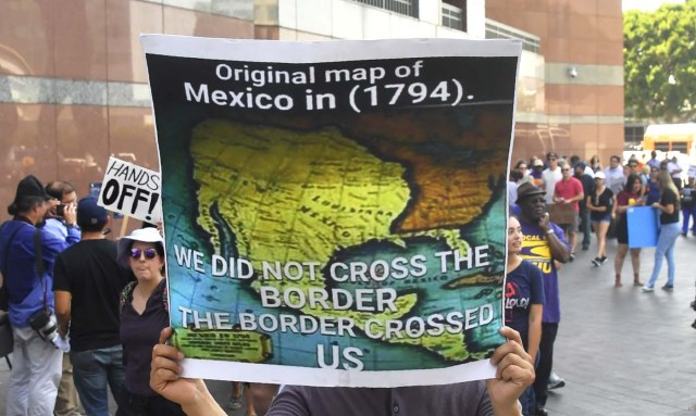 A map of Mexico as it was in 1794 is displayed as young immigrants and their supporters rally in support of Deferred Action for Childhood Arrivals (DACA) in Los Angeles, California on September 1, 2017. A decision is expected in coming days on whether US President Trump will end the program by his predecessor, former President Obama, on DACA which has protected some 800,000 undocumented immigrants, also known as Dreamers, since 2012. / AFP PHOTO / FREDERIC J. BROWN