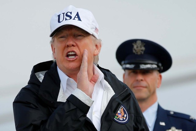 U.S. President Donald Trump answers a reporter's question as he boards Air Force One for travel to view Hurricane Irma response efforts in Florida, from Joint Base Andrews, Maryland, U.S., September 14, 2017. REUTERS/Jonathan Ernst