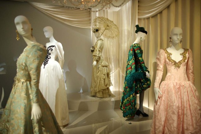 Dresses and hat creations are displayed at the Yves Saint Laurent Museum in Paris, France, September 27, 2017. The new museum, celebrating the life and work of French designer Yves Saint Laurent (1936-2008), will open at the avenue Marceau address of his former work studio for almost 30 years. Picture taken September 27, 2017. REUTERS/Stephane Mahe