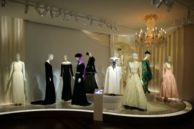 Dresses and hat creations are displayed at the Yves Saint Laurent Museum in Paris, France, September 27, 2017. The new museum, celebrating the life and work of French designer Yves Saint Laurent (1936-2008), will open at the avenue Marceau address of his former work studio for almost 30 years. Picture taken September 27, 2017. REUTERS/Stephane Mahe