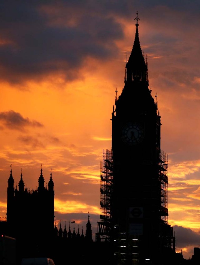 Elizabeth Tower, commonly known as Big Ben, partially covered in scaffolding during repair works on the Houses of Parliament, sits in the foreground of a sunset, in London, Britain, October 7, 2017. REUTERS/Afolabi Sotunde