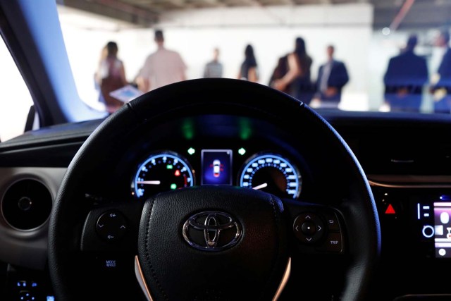 The logo of Toyota Motor Corp. is seen on a steering wheel of the company's Corolla car in Caracas, Venezuela October 25, 2017. REUTERS/Marco Bello