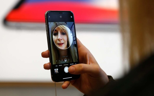 A customer uses the new face-recognition software on the new iPhone X inside the Apple Store in Regents Street in London, Britain, November 3, 2017. REUTERS/Peter Nicholls