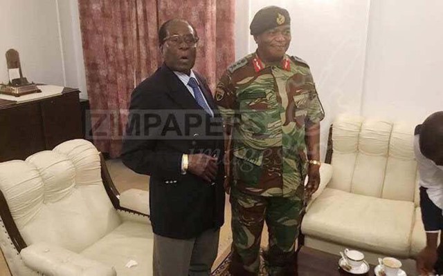 President Robert Mugabe poses with General Constantino Chiwenga at State House in Harare, Zimbabwe, November 16, 2017. ZIMPAPERS/Joseph Nyadzayo/Handout via REUTERS ATTENTION EDITORS - THIS IMAGE HAS BEEN SUPPLIED BY A THIRD PARTY. NO RESALES. NO ARCHIVES. ZIMBABWE OUT