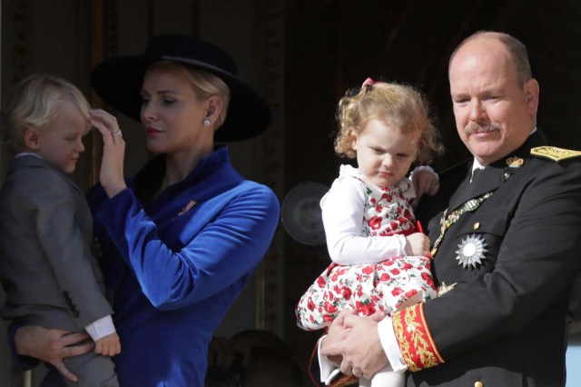 Prince Albert II of Monaco and his wife Princess Charlene hold their twins Prince Jacques and Princess Gabriella as they stand at the Palace Balcony during the celebrations marking Monaco's National Day, November 19, 2017. REUTERS/Eric Gaillard