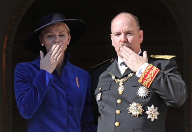 Prince Albert II of Monaco and his wife Princess Charlene blow a kiss from the Palace Balcony during the celebrations marking Monaco's National Day, November 19, 2017. REUTERS/Eric Gaillard