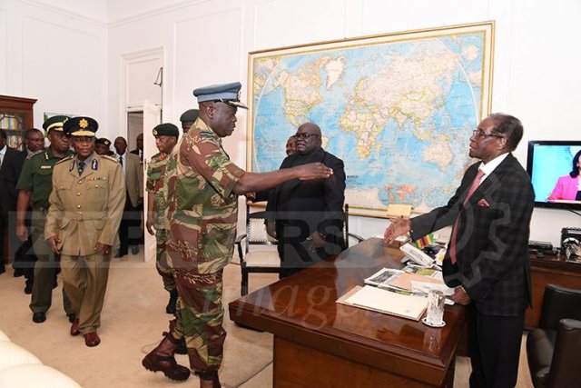 President Robert Mugabe meets with senior members of the Zimbabwe Defence Forces and police at State House in Harare, Zimbabwe November 19, 2017. ZIMPAPERS/Joseph Nyadzayo/Handout via REUTERS ATTENTION EDITORS - THIS IMAGE HAS BEEN SUPPLIED BY A THIRD PARTY. NO RESALES. NO ARCHIVES. ZIMBABWE OUT