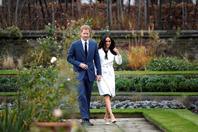 Britain's Prince Harry walks with Meghan Markle in the Sunken Garden of Kensington Palace, London, Britain, November 27, 2017. REUTERS/Toby Melville