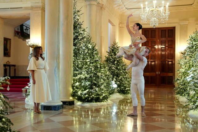 Ballet dancers perform as U.S. first lady Melania Trump begins a tour of the holiday decorations with reporters at the White House in Washington, U.S., November 27, 2017. REUTERS/Jonathan Ernst