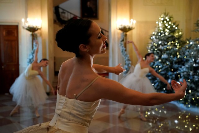 Ballerinas perform before U.S. First Lady Melania Trump (not pictured) begins a tour of the holiday decorations with reporters at the White House in Washington, U.S. November 27, 2017.  REUTERS/Jonathan Ernst