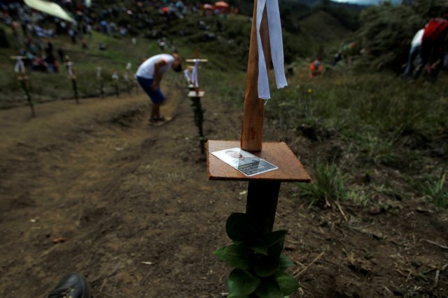 People pay tribute on the first anniversary of the plane crash where several players of the Chapecoense soccer team died, in La Union, Colombia November 28, 2017. REUTERS/Fredy Builes