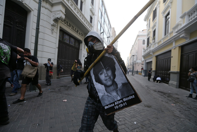 Protesters march after Peruvian President Pedro Pablo Kuczynski pardoned former President Alberto Fujimori in Lima, Peru, December 25, 2017. REUTERS/Mariana Bazo