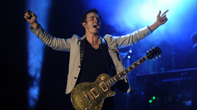 US singer Kevin Jonas, member of The Jonas Brother's group, performs at the stage at the Ricardo Saprissa Stadium during a concert in San Jose on October 26, 2010.AFP  PHOTO/ Yuri CORTEZ (Photo credit should read YURI CORTEZ/AFP/Getty Images)
