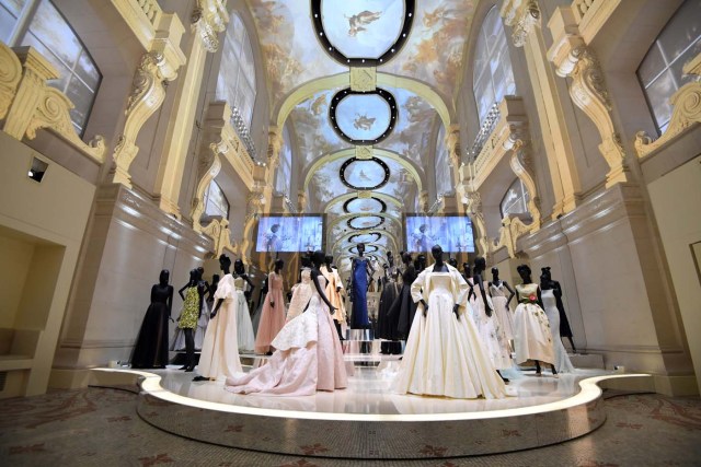 (FILES) This file picture taken on July 3, 2017 shows dresses exhibited during the Dior exhibition that celebrates the seventieth anniversary of the Christian Dior fashion house at the Museum of Decorative Arts (Musee des Arts Decoratifs) in Paris. 708 000 people visited the exhibition dedicated to Christian Dior from July 5, 2017 to January 7, 2018 in Paris. / AFP PHOTO / ALAIN JOCARD