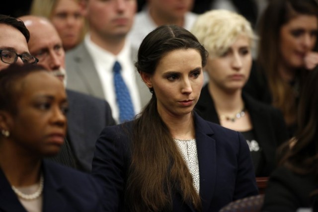 Rachael Denhollander who was victimized by former Michigan State University and USA Gymnastics doctor Larry Nassar listens during the sentencing phase in Ingham County Circuit Court on January 24, 2018 in Lansing, Michigan. Disgraced former USA Gymnastics doctor Larry Nassar was sentenced to 40 to 175 years in prison on Wednesday for sexually abusing scores of young girls under the guise of medical treatment. "I've just signed your death warrant," Judge Rosemarie Aquilina said as she handed down the sentence after a week of gut-wrenching testimony by over 150 of Nassar's victims.  / AFP PHOTO / JEFF KOWALSKY