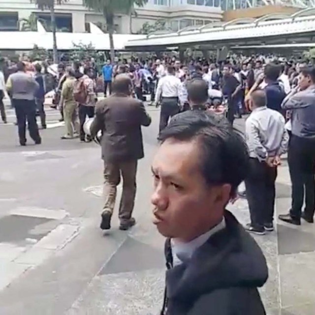 People gather outside the stock exchange in Jakarta, Indonesia January 15, 2018 in this still image taken from video obtained from social media. Instagram @cpcrow/via REUTERS ATTENTION EDITORS - THIS IMAGE HAS BEEN SUPPLIED BY A THIRD PARTY. NO RESALES. NO ARCHIVES. MANDATORY CREDIT