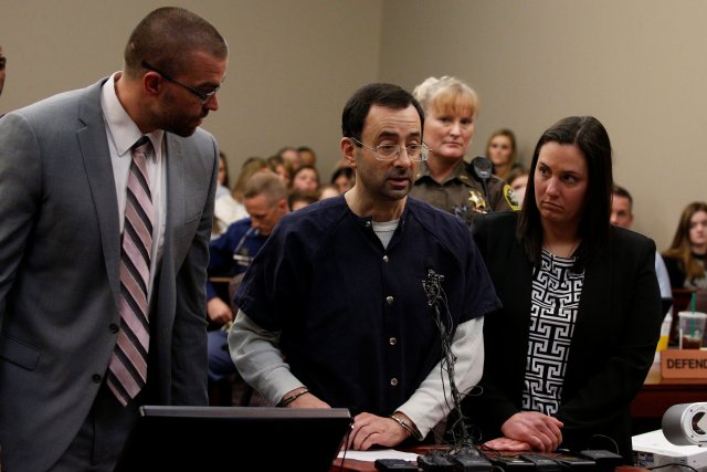 Larry Nassar, (C) a former team USA Gymnastics doctor who pleaded guilty in November 2017 to sexual assault charges, makes a statement in the courtroom during his sentencing hearing in Lansing, Michigan, U.S., January 24, 2018. REUTERS/Brendan McDermid