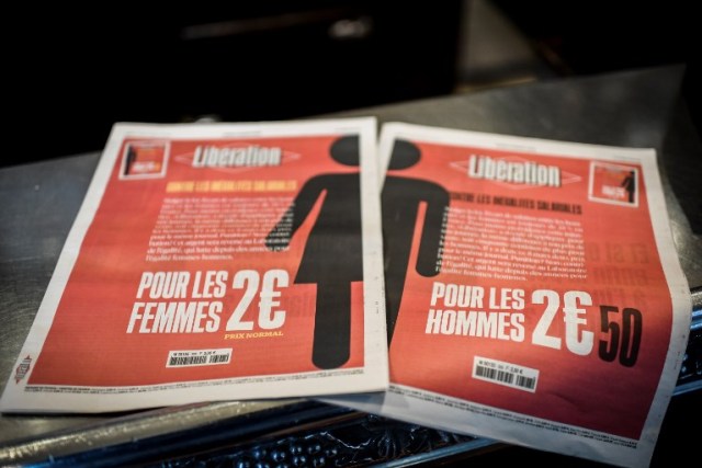 A picture taken on March 8, 2018 in Paris shows the two different front pages of the French daily newspaper Liberation during the International Woman's Day.    / AFP PHOTO / STEPHANE DE SAKUTIN