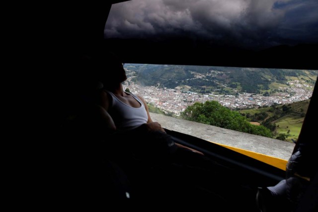 Abrahan Bastidas, 26, an I.T. specialist, looks through the window while he travels by bus from Caracas to Chile in Pamplona, Colombia, November 8, 2017. For Abrahan, the trigger to leave came mid-year when his employer, a Caracas hotel, decided it could no longer provide him with breakfast and dinner. Suddenly, all his income was going towards food. "As a professional it was impossible to continue like that" he said. REUTERS/Carlos Garcia Rawlins SEARCH "RAWLINS BUS" FOR THIS STORY. SEARCH "WIDER IMAGE" FOR ALL STORIES.