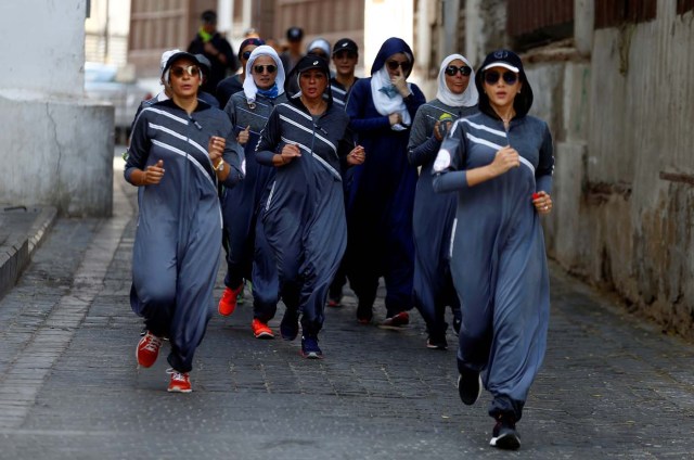 Women run during an event marking International Women's Day in Old Jeddah, Saudi Arabia March 8, 2018. REUTERS/Faisal Al Nasser