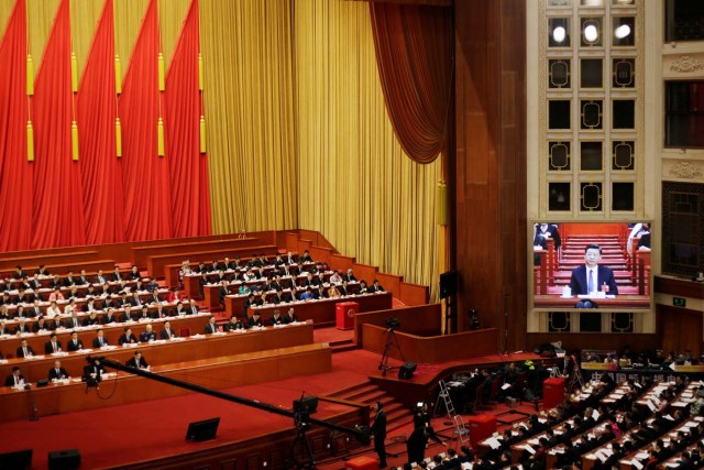 Chinese president Xi Jinping is seen on a giant screen after the parliament passed a constitutional amendment lifting presidential term limits, at the third plenary session of the National People's Congress (NPC) at the Great Hall of the People in Beijing, China March 11, 2018. REUTERS/Jason Lee