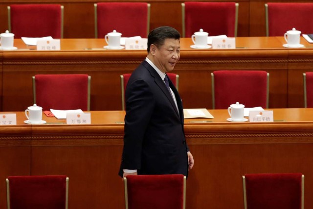 Chinese President Xi Jinping arrives for the third plenary session of the National People's Congress (NPC), where delegates will vote on a constitutional amendment lifting presidential term limits, at the Great Hall of the People in Beijing, China March 11, 2018. REUTERS/Jason Lee