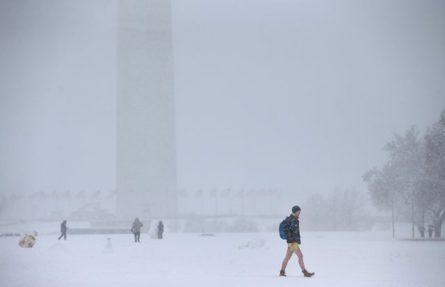 A person walks across the National Mall in Washington, U.S., March 21, 2018. REUTERS/Leah Millis