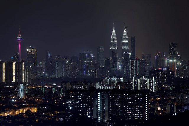 General view of Petronas Twin Towers as lights were switched back on after marking the Earth Hour in Kuala Lumpur, Malaysia March 24, 2018. REUTERS/Stringer NO RESALES. NO ARCHIVES.